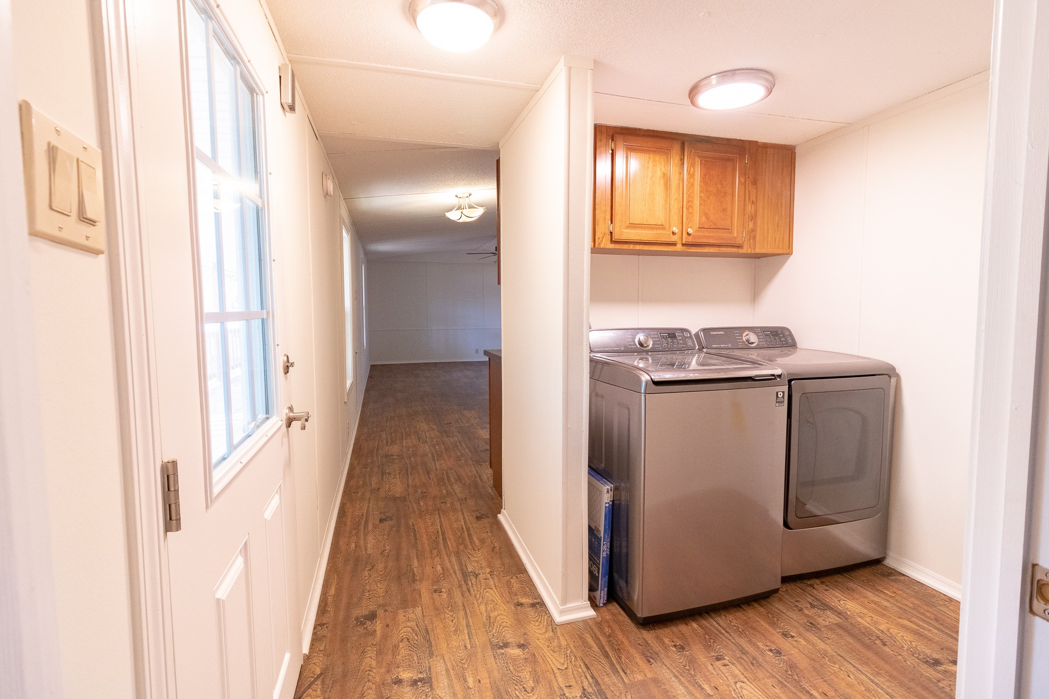 833 Speck Road Lebanon, TN 37087 - Photo 5 of 40 a view of a kitchen with wooden floor and cabinets