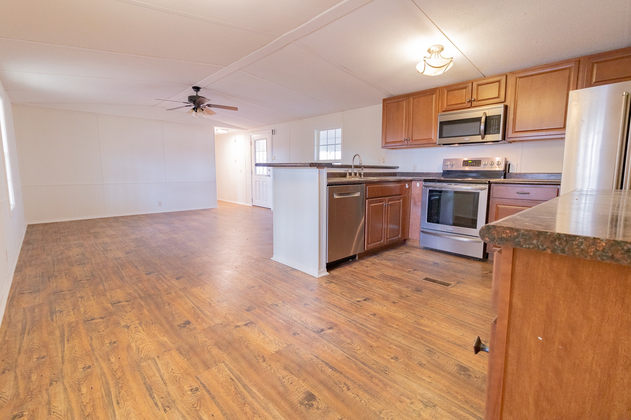 833 Speck Road Lebanon, TN 37087 - Photo 8 of 40 a kitchen with stainless steel appliances granite countertop a refrigerator a stove top oven a sink and dishwasher