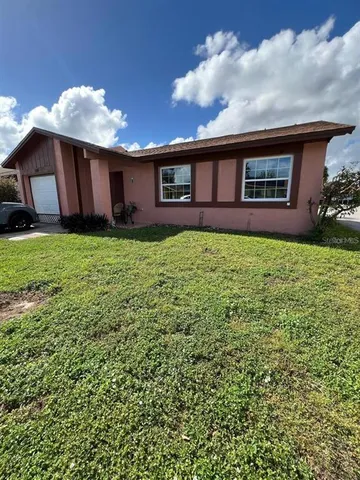 a backyard of a house with seating space
