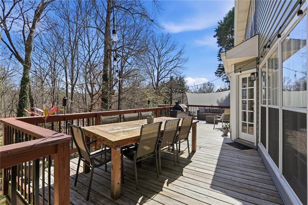 3341 Danielle Way Suwanee, GA 30024 - Photo 15 of 39 a view of a dinning tables and chairs in deck patio