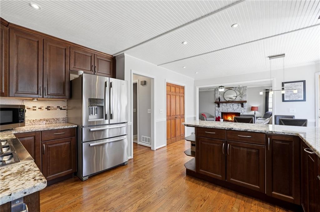 3341 Danielle Way Suwanee, GA 30024 - Photo 20 of 39 a kitchen with granite countertop a refrigerator and a sink