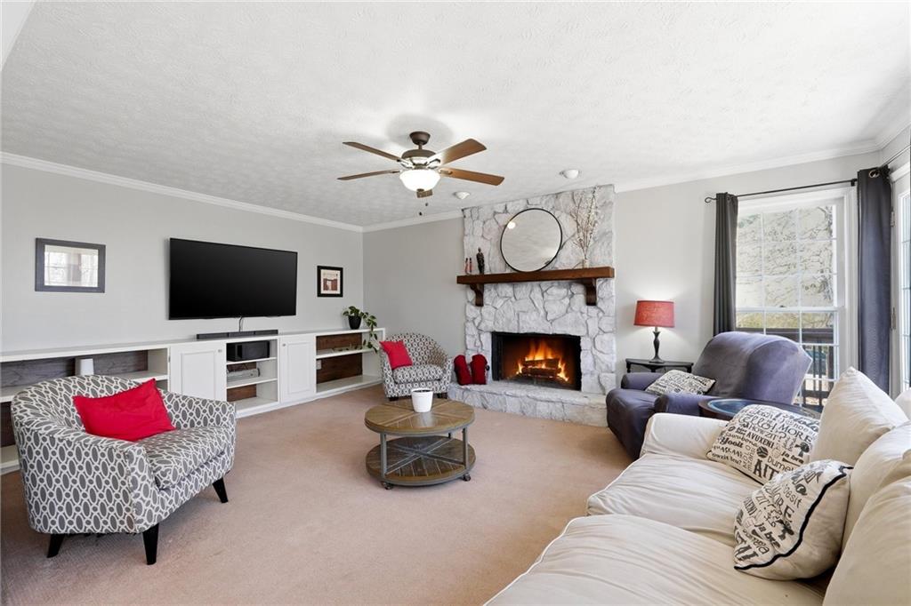 3341 Danielle Way Suwanee, GA 30024 - Photo 23 of 39 a living room with furniture fireplace and flat screen tv