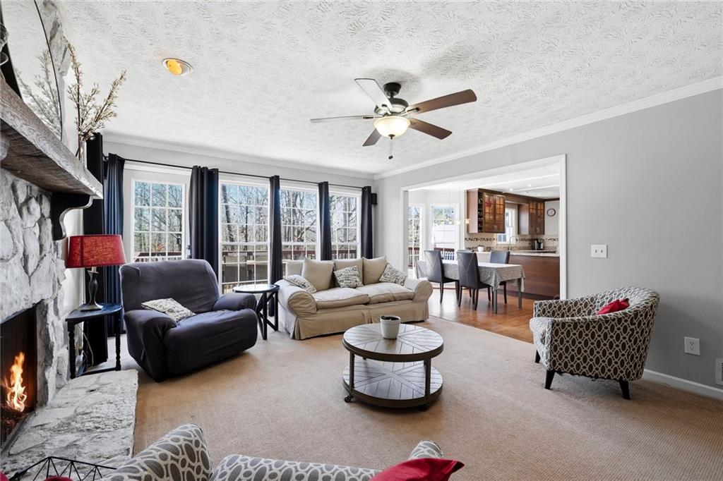 3341 Danielle Way Suwanee, GA 30024 - Photo 24 of 39 a living room with furniture and a large window
