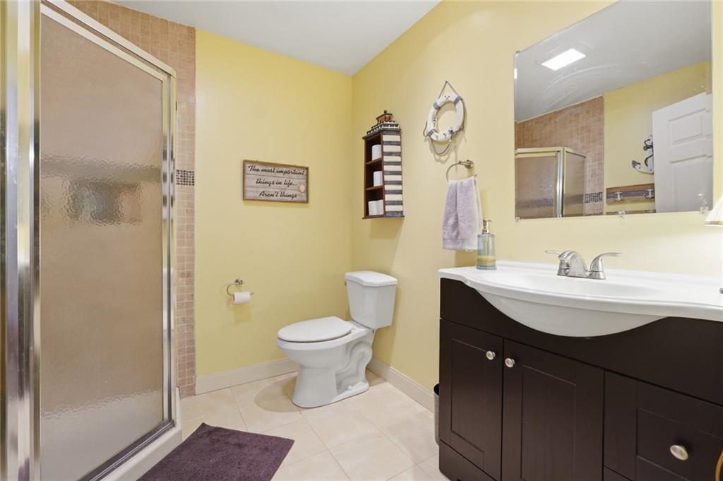 3341 Danielle Way Suwanee, GA 30024 - Photo 30 of 39 a bathroom with a sink a toilet and shower