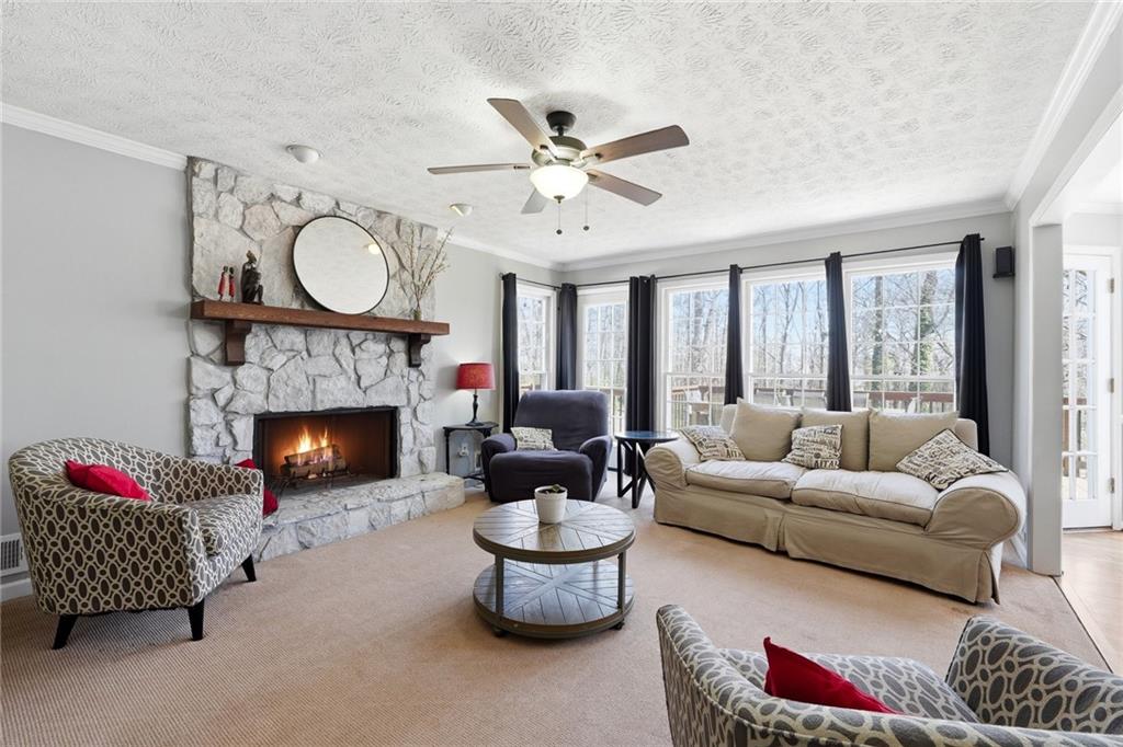 3341 Danielle Way Suwanee, GA 30024 - Photo 3 of 39 a living room with furniture fireplace and window