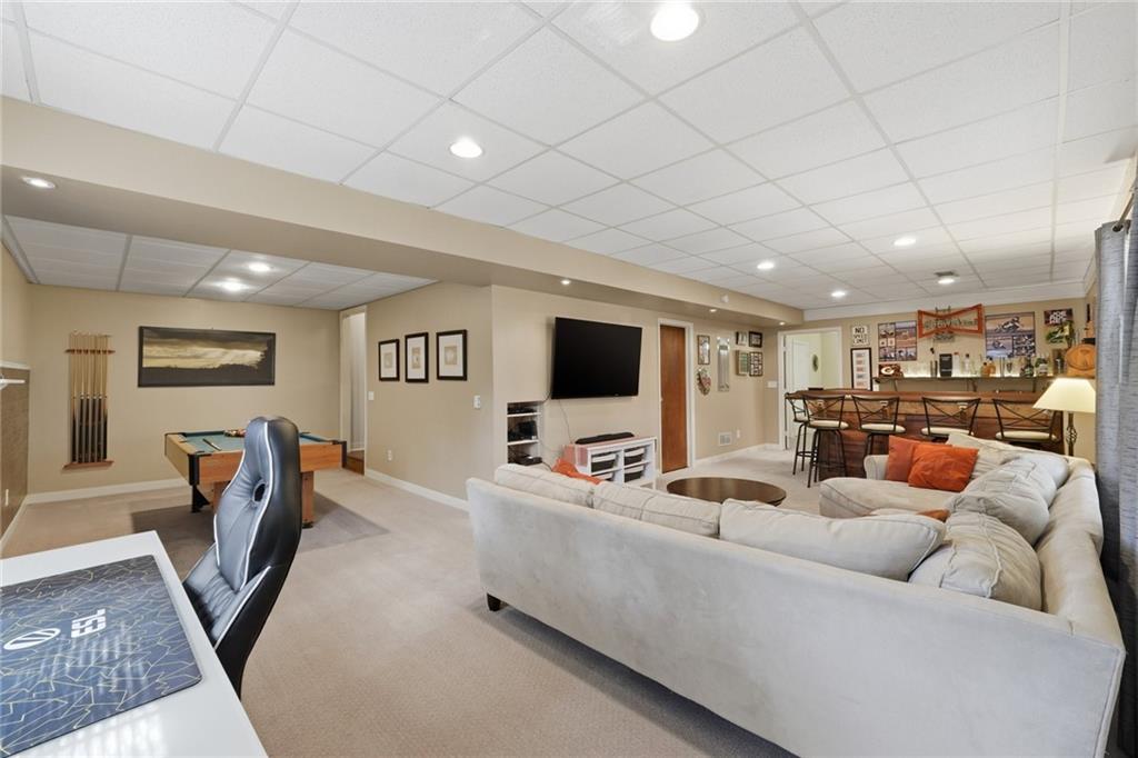 3341 Danielle Way Suwanee, GA 30024 - Photo 32 of 39 a living room with furniture and a flat screen tv