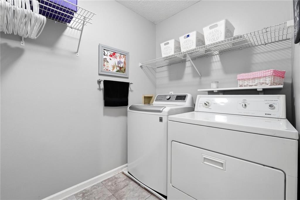 3341 Danielle Way Suwanee, GA 30024 - Photo 33 of 39 a utility room with dryer and washer