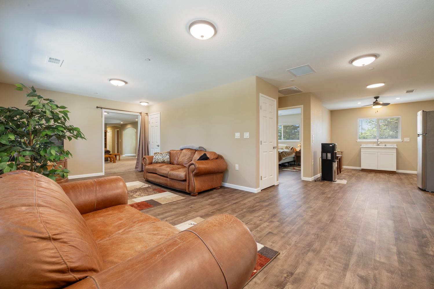 1255 Root Road Modesto, CA 95357 - Photo 14 of 52 a spacious bedroom with a bed and a couch