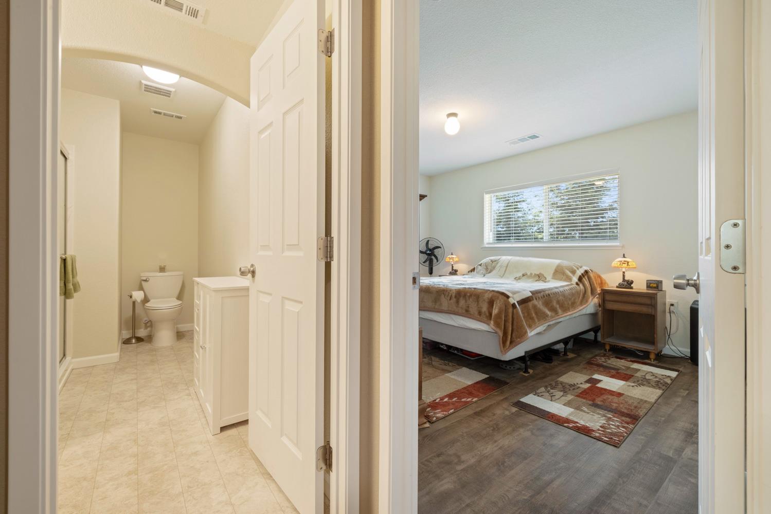 1255 Root Road Modesto, CA 95357 - Photo 17 of 52 a bedroom with a bed and a view of bathroom