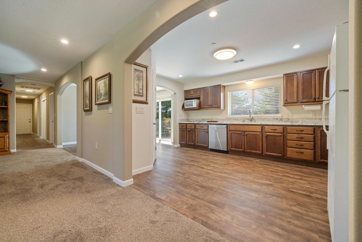 1255 Root Road Modesto, CA 95357 - Photo 20 of 52 a view of kitchen with stainless steel appliances granite countertop a refrigerator and a sink