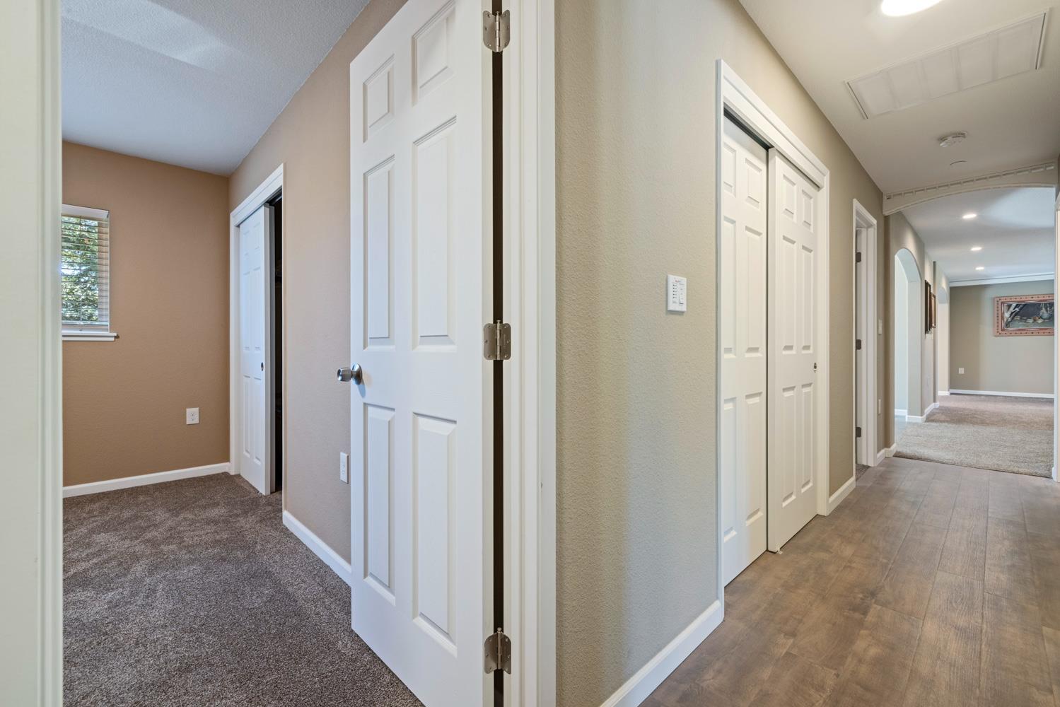 1255 Root Road Modesto, CA 95357 - Photo 33 of 52 a view of a hallway with wooden shelves