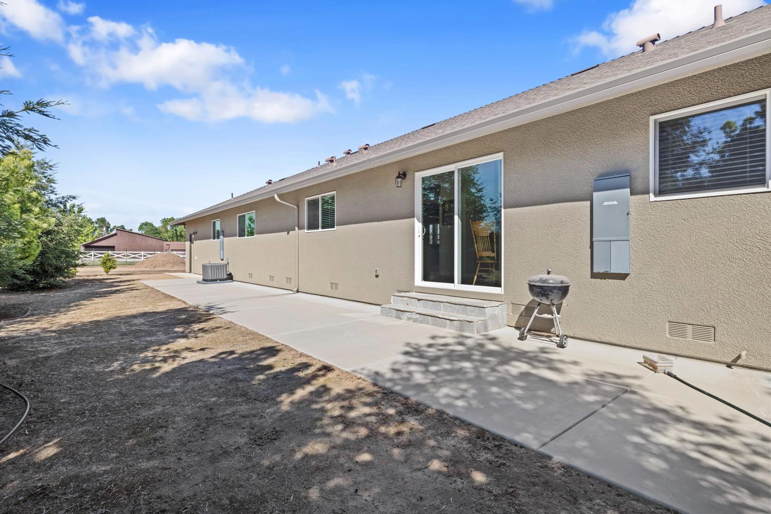 1255 Root Road Modesto, CA 95357 - Photo 35 of 52 a front view of a house with a yard