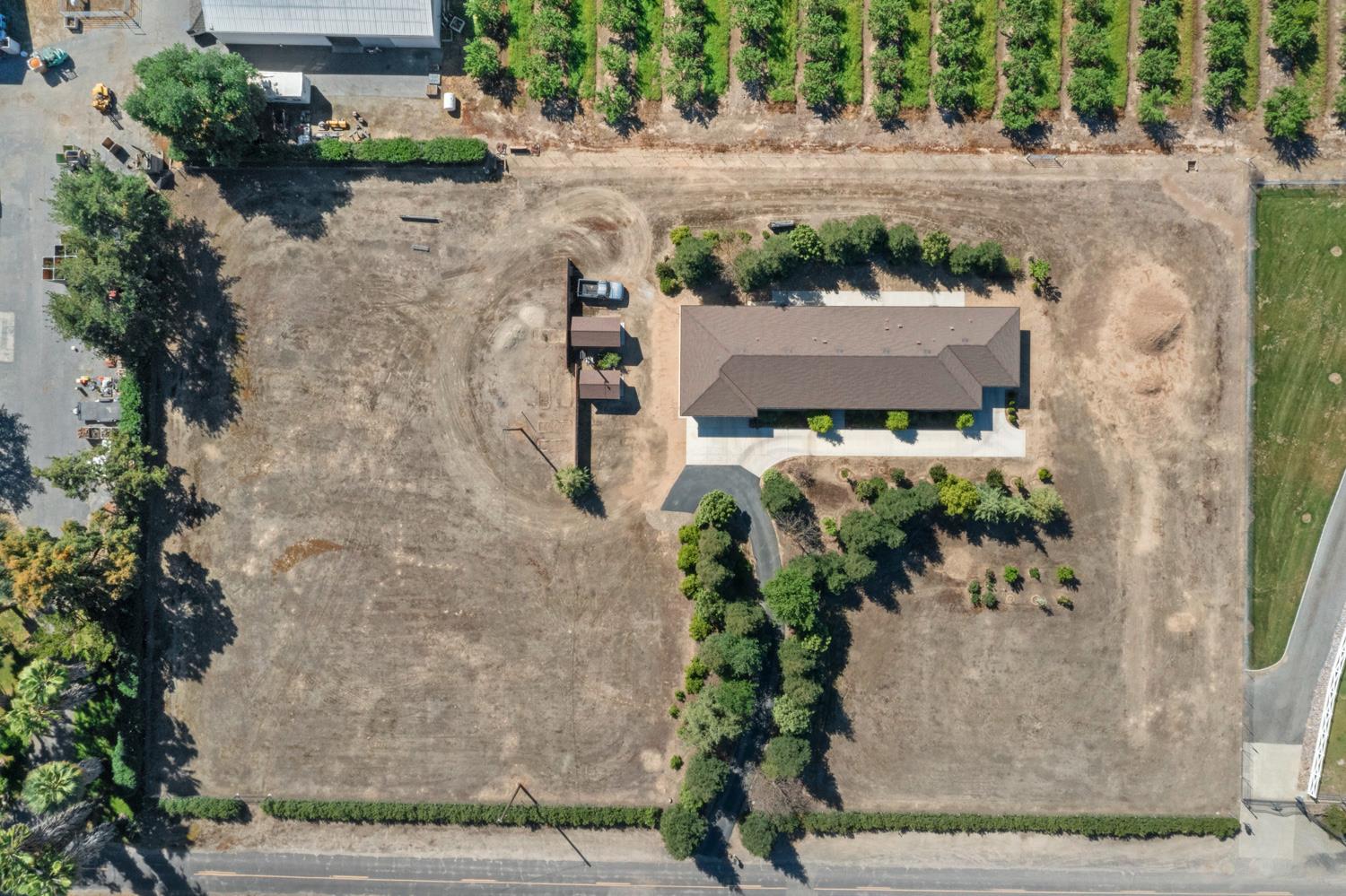1255 Root Road Modesto, CA 95357 - Photo 46 of 52 an aerial view of a house with a yard and plants