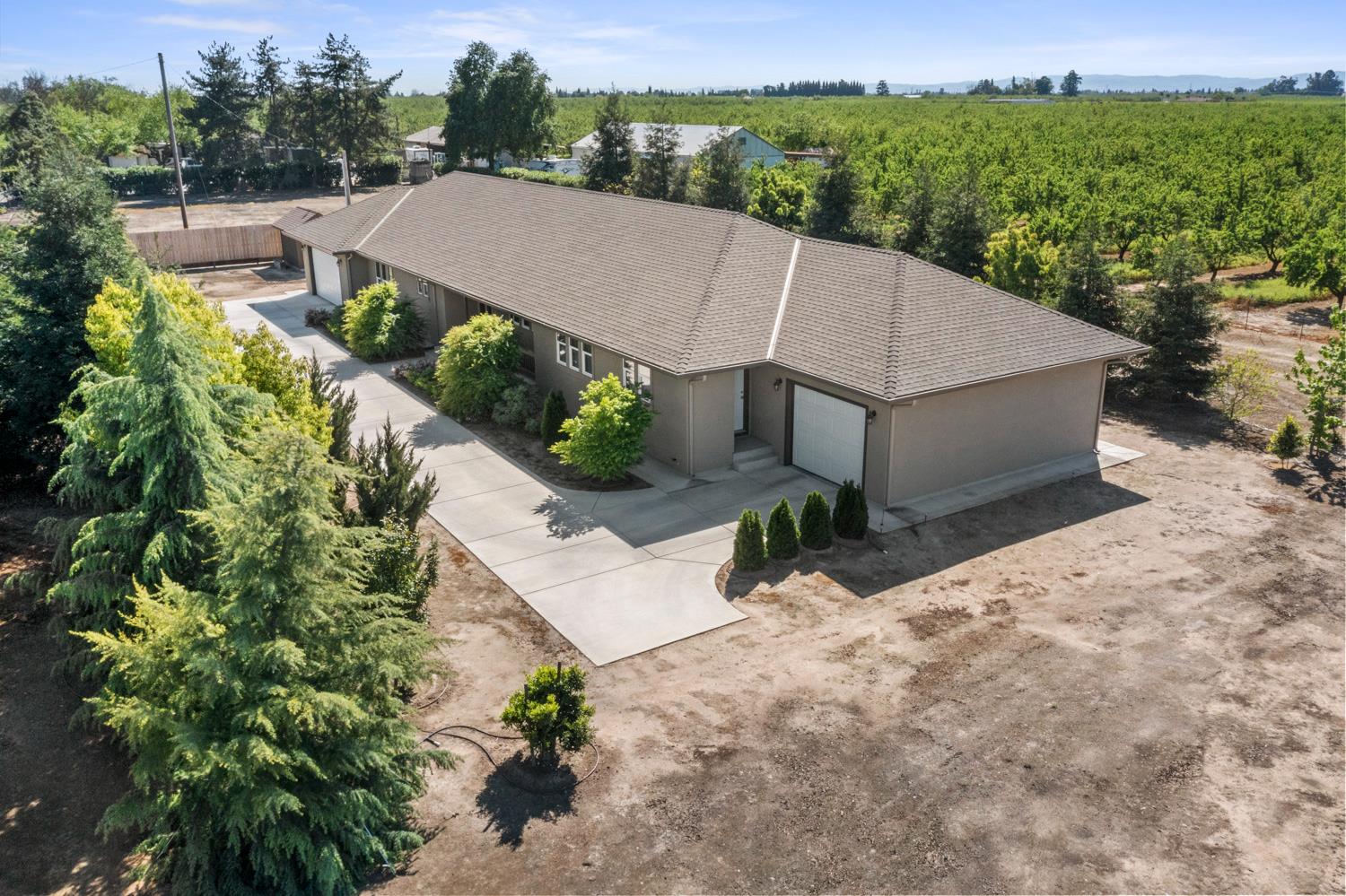 1255 Root Road Modesto, CA 95357 - Photo 48 of 52 an aerial view of a house with a garden