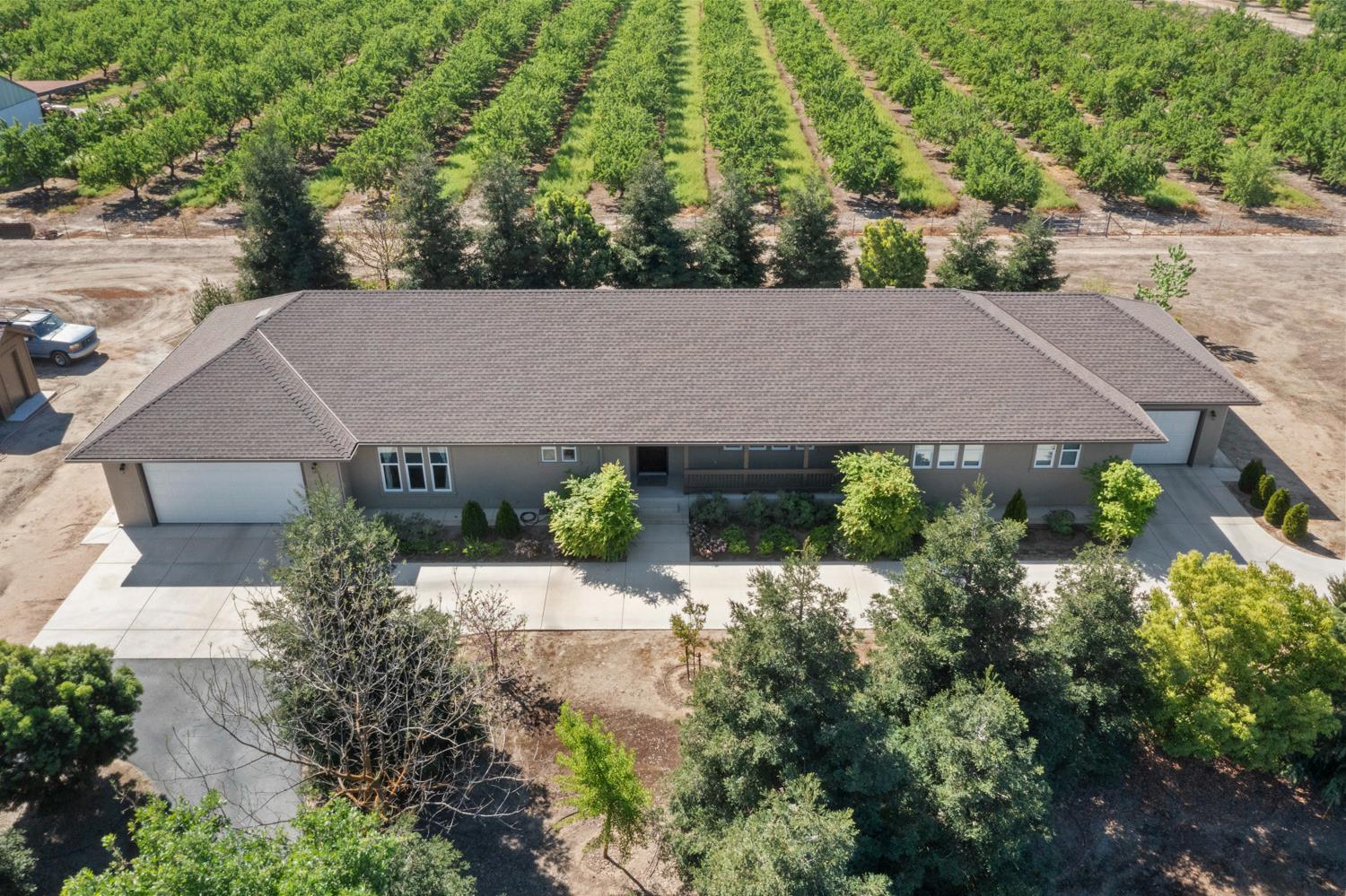 1255 Root Road Modesto, CA 95357 - Photo 49 of 52 an aerial view of a house with a yard and potted plants