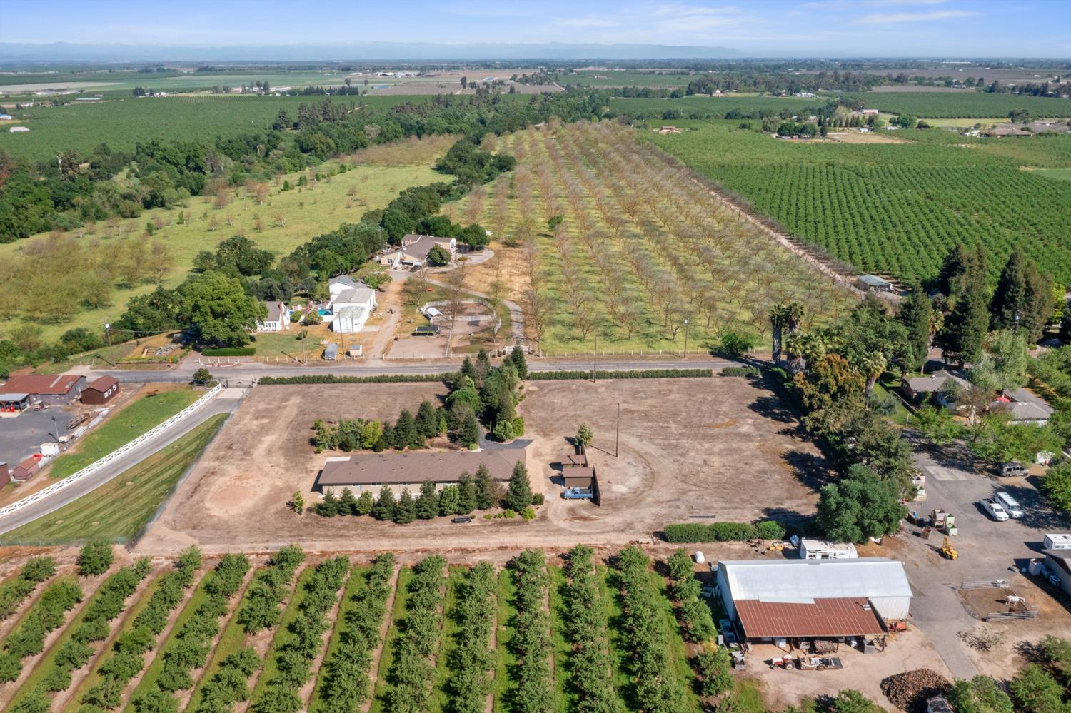 1255 Root Road Modesto, CA 95357 - Photo 51 of 52 an aerial view of a house with a garden and lake view