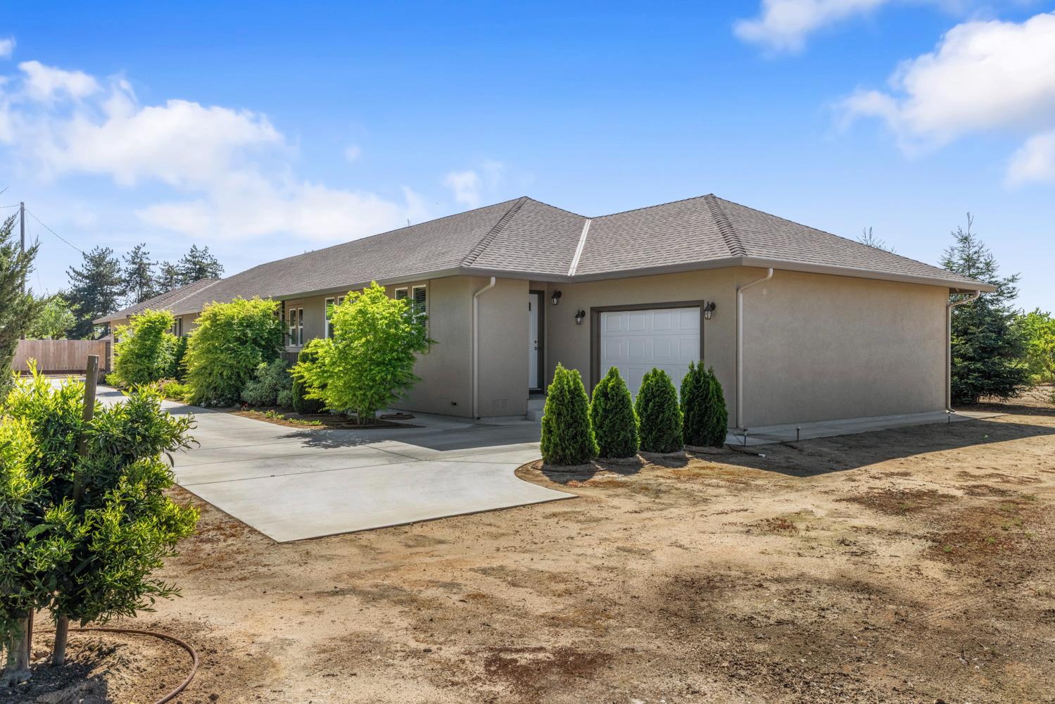 1255 Root Road Modesto, CA 95357 - Photo 6 of 52 a front view of house with yard and green space