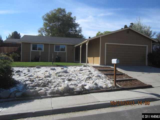 3916 Kings Row Reno, NV 89503 - Photo 1 of 10 a front view of house with yard and trees