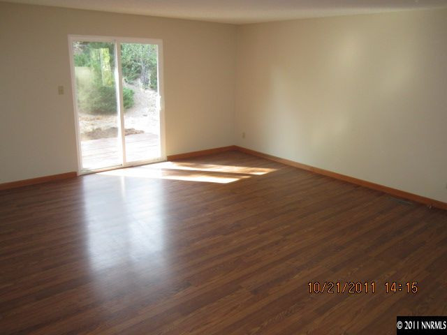 3916 Kings Row Reno, NV 89503 - Photo 3 of 10 a view of empty room with wooden floor and fan