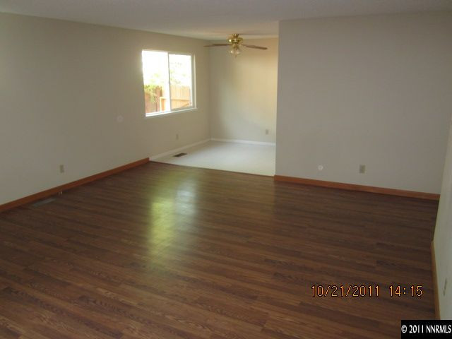 3916 Kings Row Reno, NV 89503 - Photo 4 of 10 an empty room with wooden floor and windows