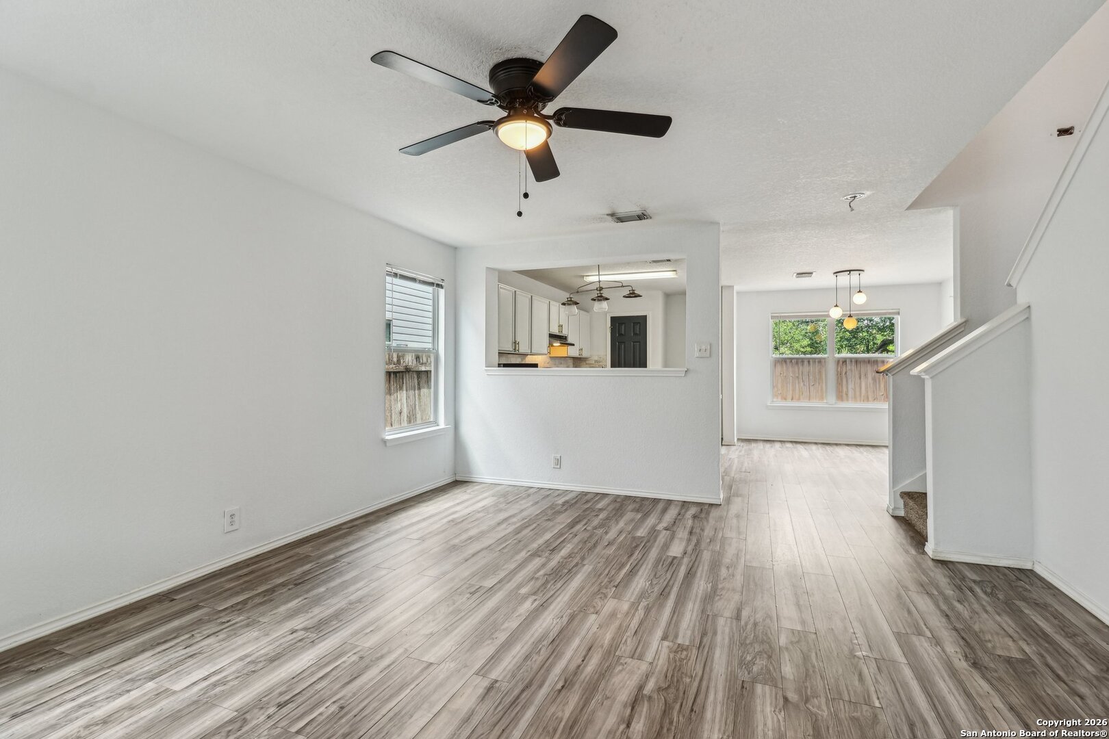 87 Kenrock Ridge San Antonio, TX 78254 - Photo 12 of 50 a view of an empty room with window and wooden floor