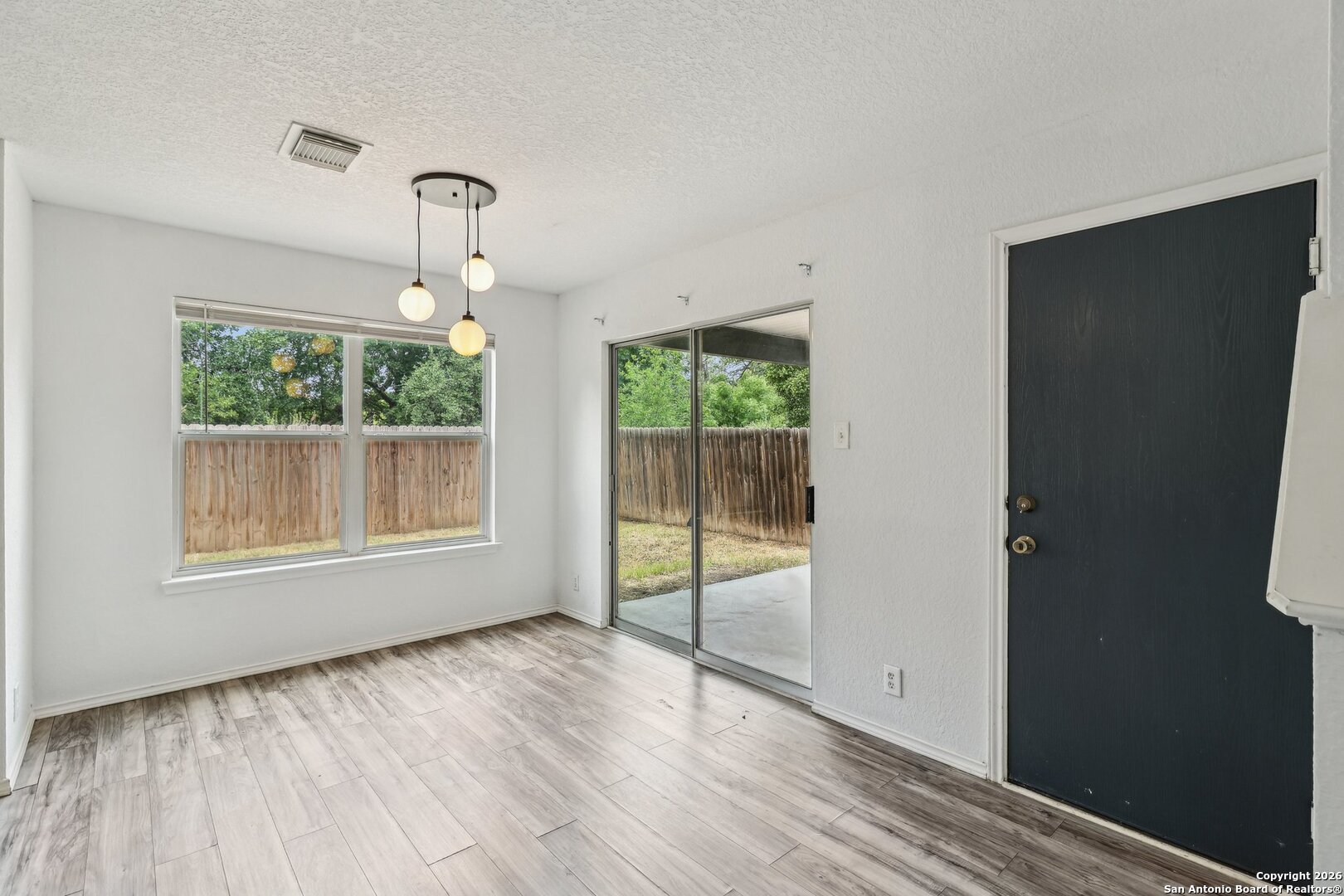 87 Kenrock Ridge San Antonio, TX 78254 - Photo 19 of 50 an empty room with wooden floor fan and windows