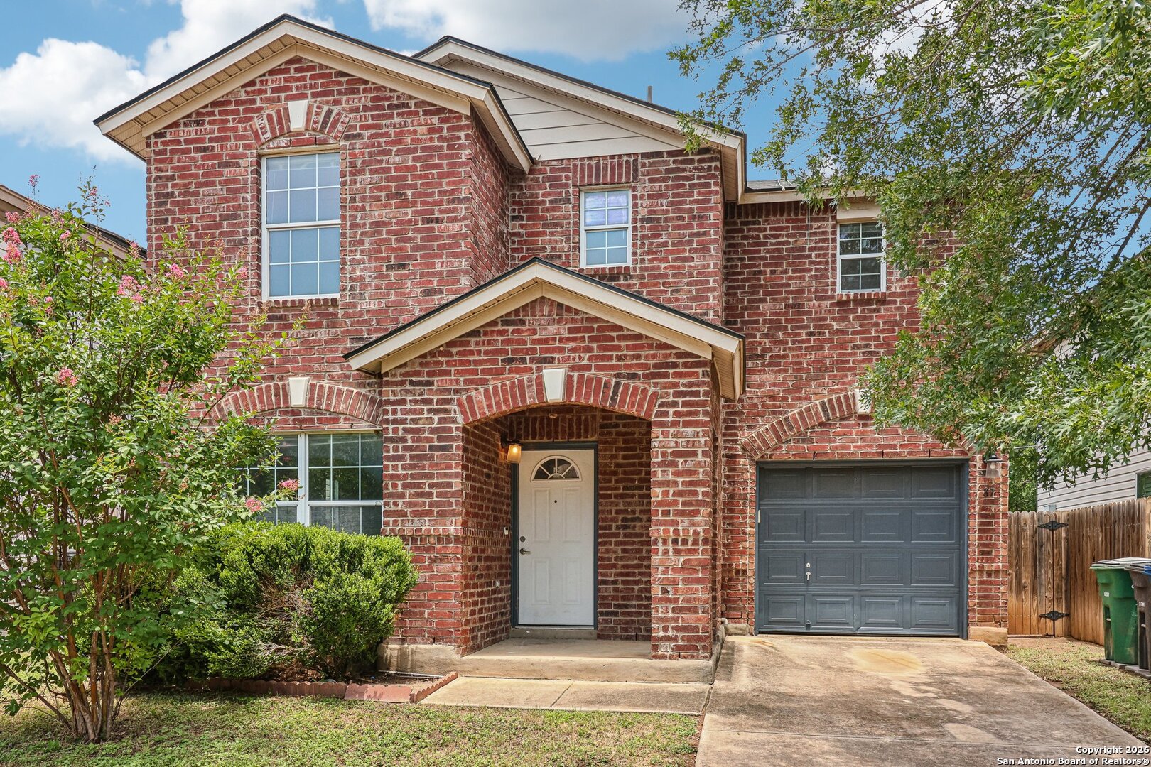87 Kenrock Ridge San Antonio, TX 78254 - Photo 2 of 50 a front view of a house with garden