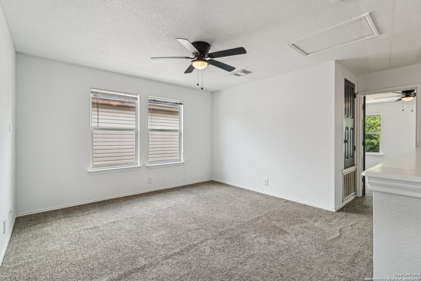 87 Kenrock Ridge San Antonio, TX 78254 - Photo 22 of 50 a view of an empty room with a window