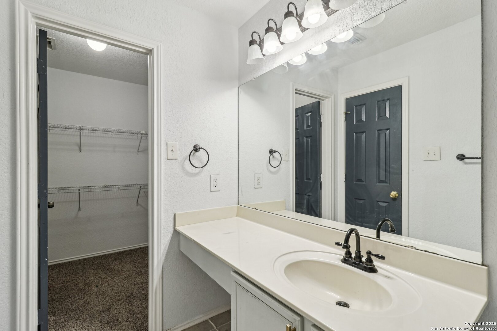 87 Kenrock Ridge San Antonio, TX 78254 - Photo 31 of 50 a bathroom with a sink vanity granite shower and a mirror