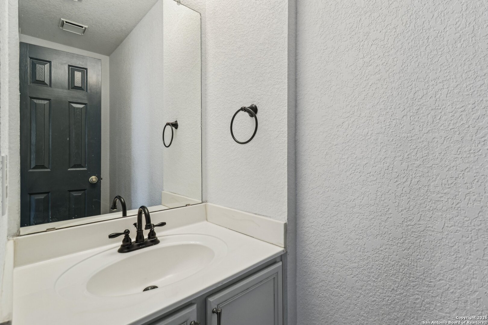 87 Kenrock Ridge San Antonio, TX 78254 - Photo 34 of 50 a bathroom with a sink and a mirror