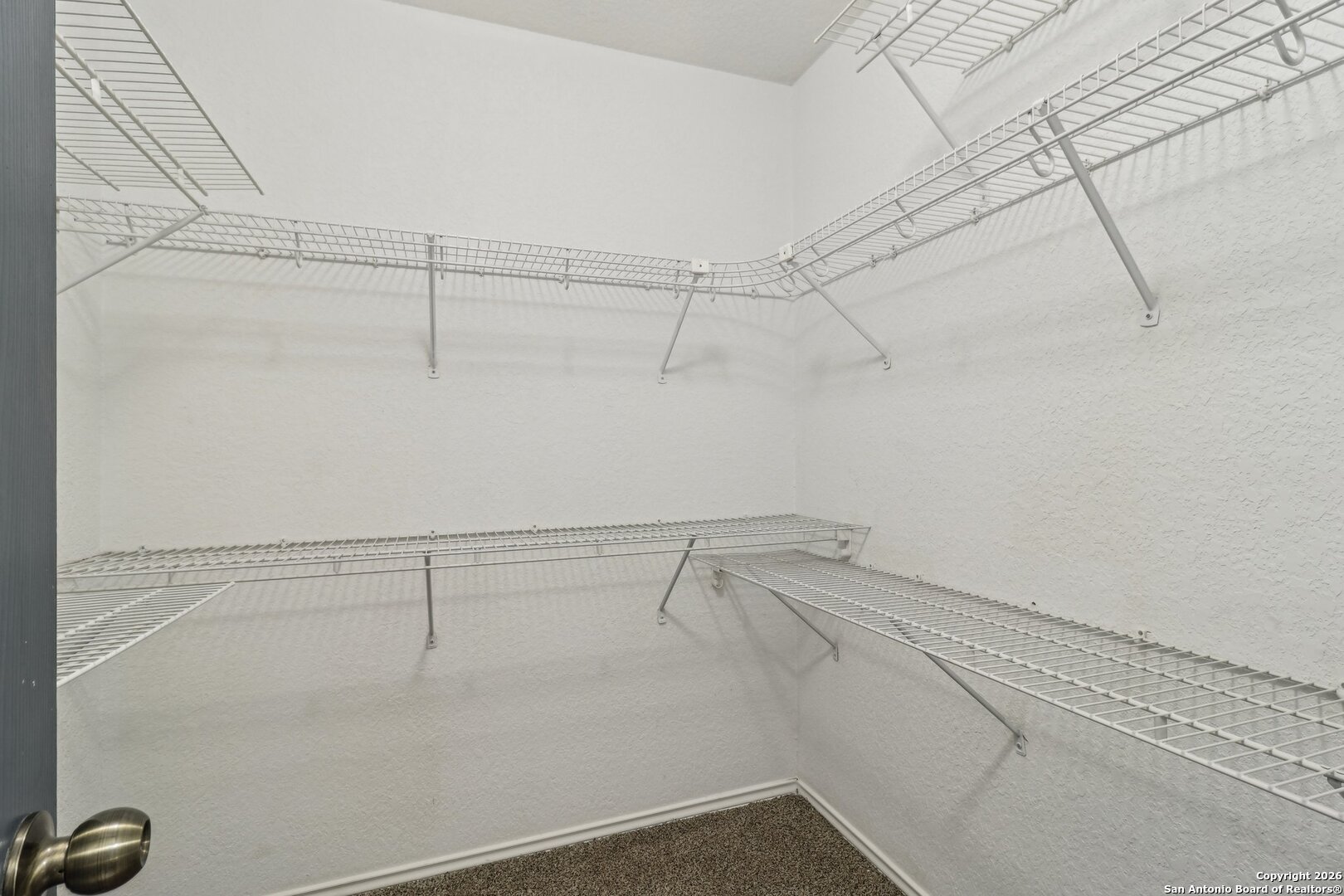 87 Kenrock Ridge San Antonio, TX 78254 - Photo 35 of 50 a view of a room with racks on the wall