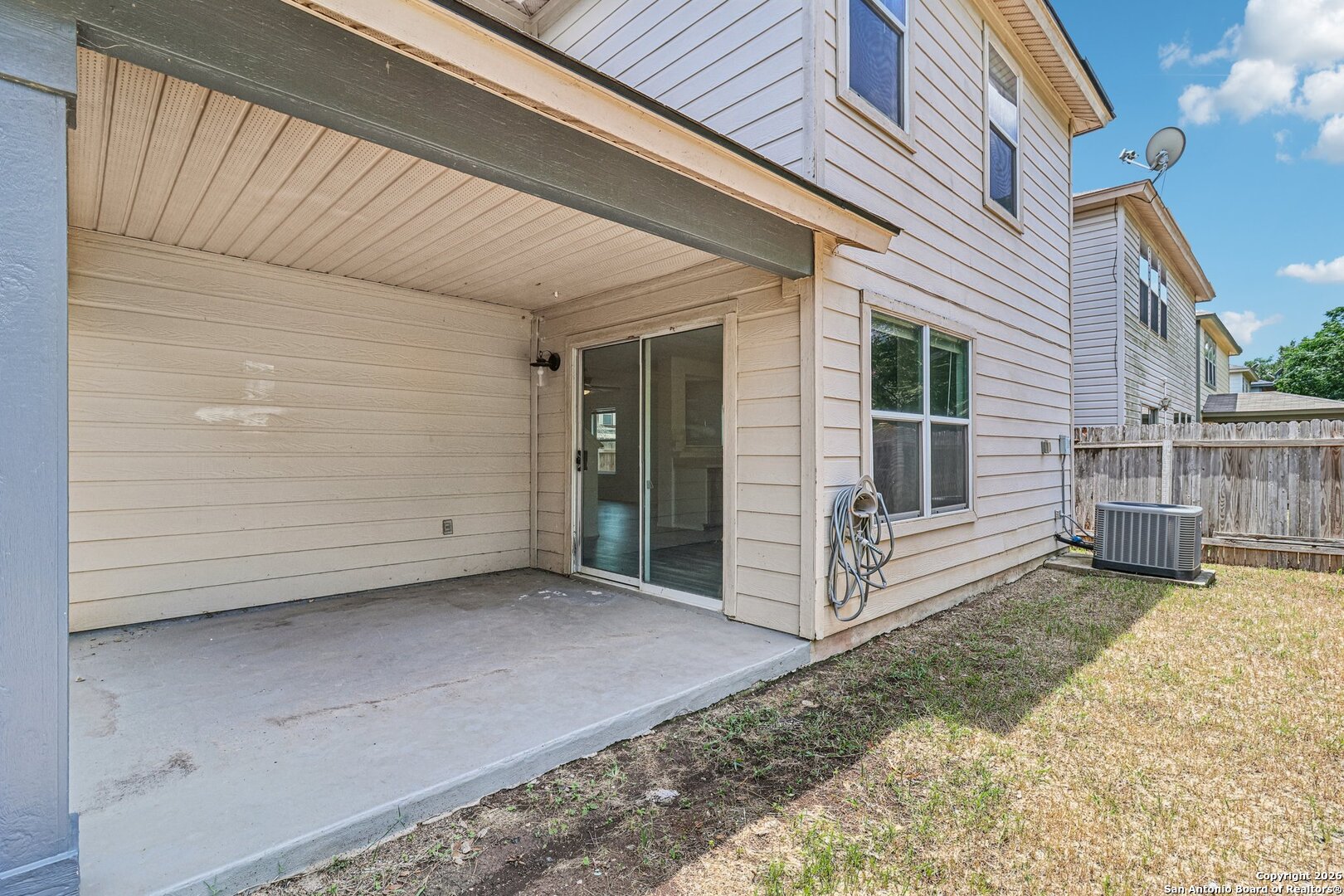 87 Kenrock Ridge San Antonio, TX 78254 - Photo 42 of 50 a view of a house with a wooden fence and floor to ceiling window