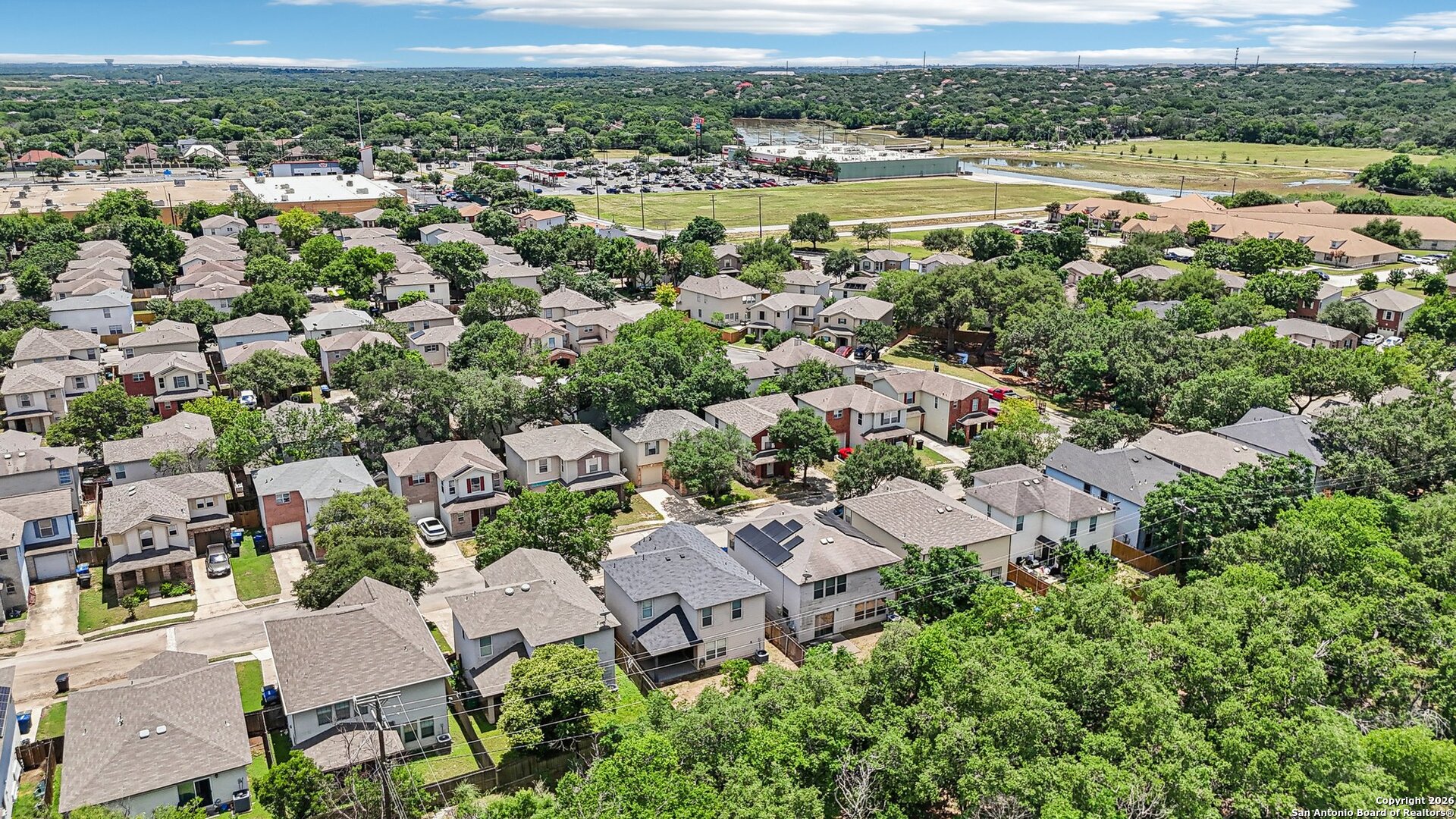 87 Kenrock Ridge San Antonio, TX 78254 - Photo 49 of 50 an aerial view of a city with lots of residential buildings