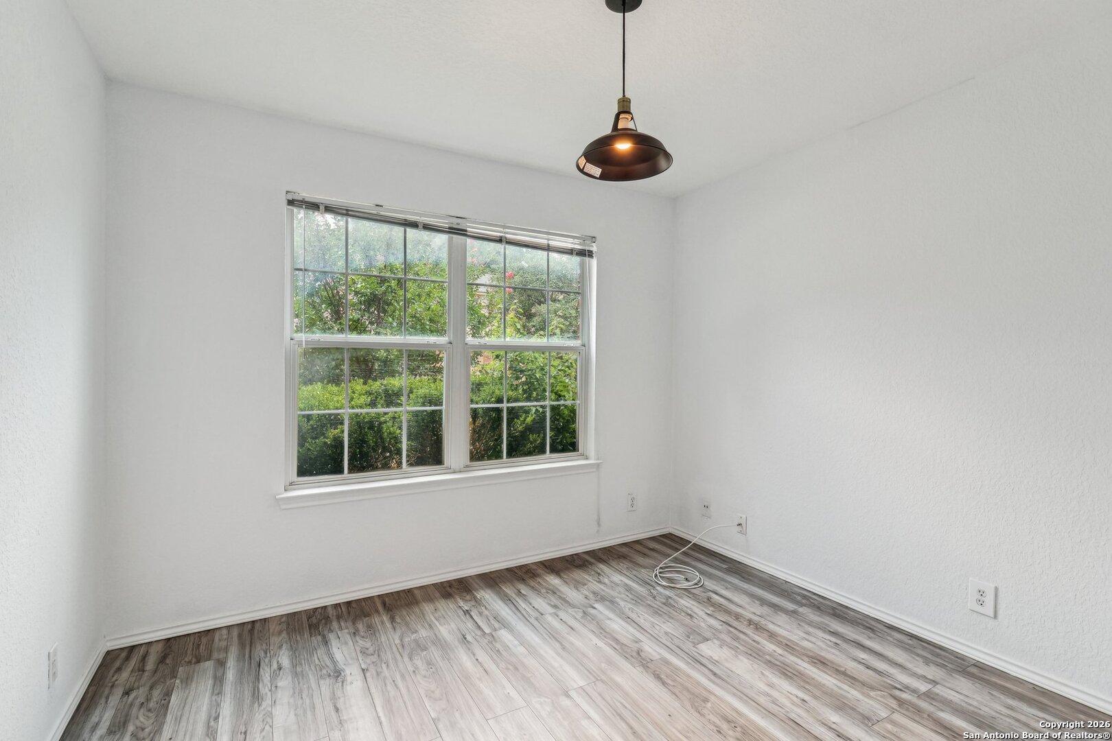 87 Kenrock Ridge San Antonio, TX 78254 - Photo 6 of 50 a view of an empty room with a window