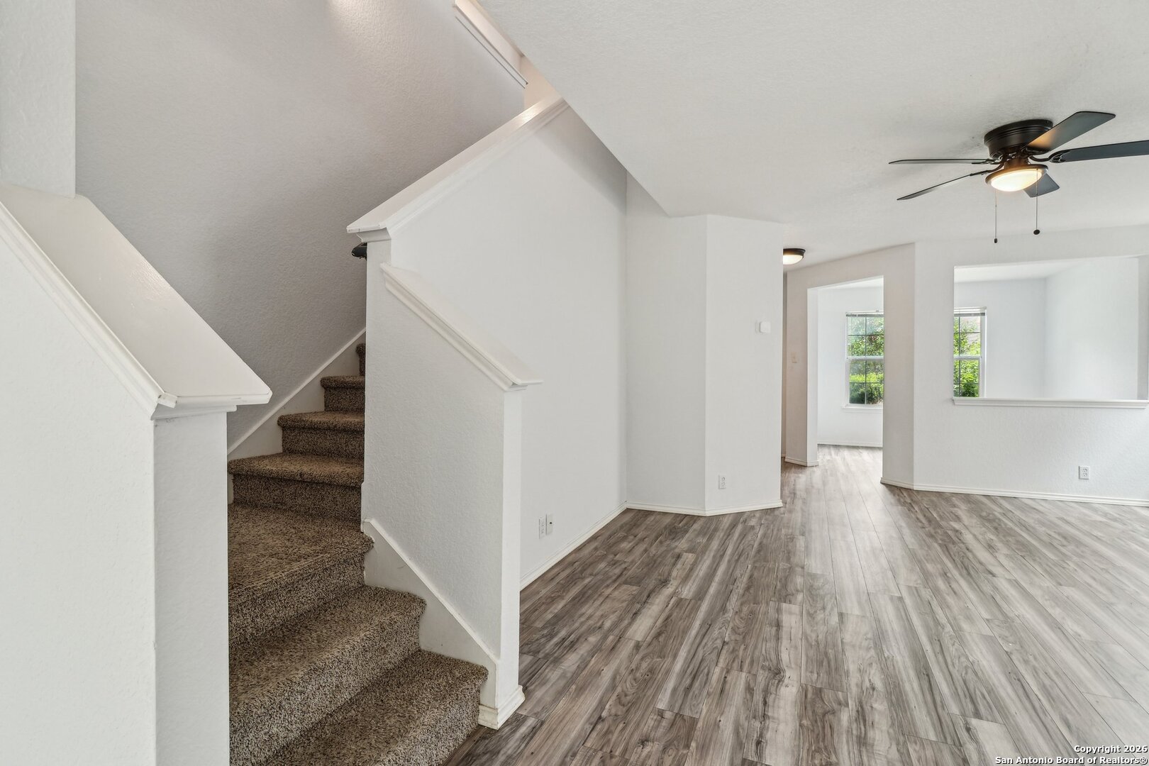 87 Kenrock Ridge San Antonio, TX 78254 - Photo 9 of 50 a view of a hallway view with wooden floor and staircase