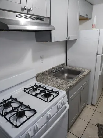 a kitchen with a stove and a sink