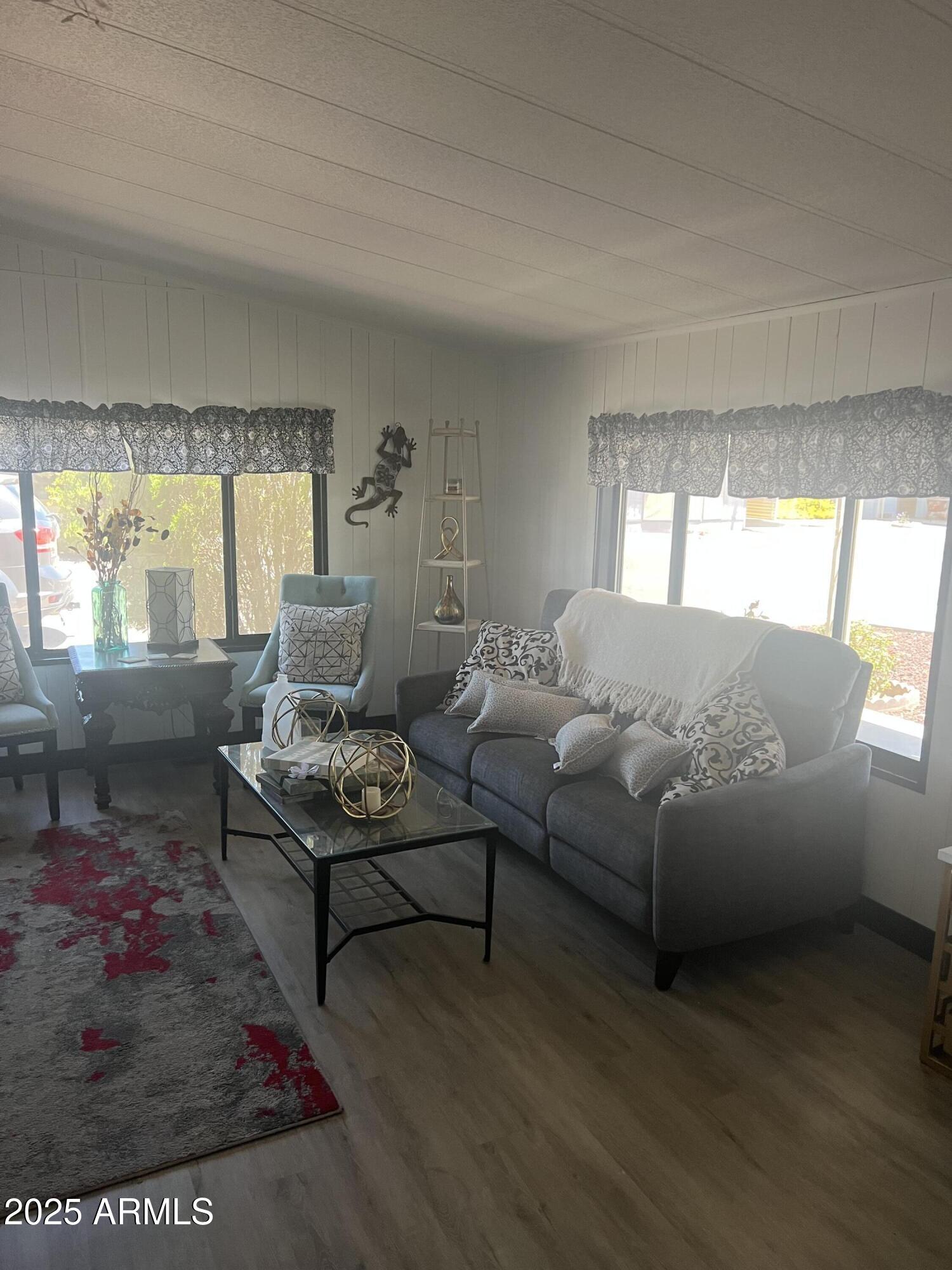 3330 East Main Street, Unit 319 Mesa, AZ 85213 - Photo 14 of 14 a living room with furniture and a large window
