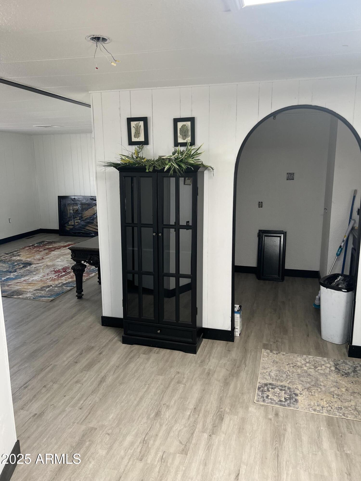 3330 East Main Street, Unit 319 Mesa, AZ 85213 - Photo 6 of 14 a view of a livingroom with furniture and wooden floor
