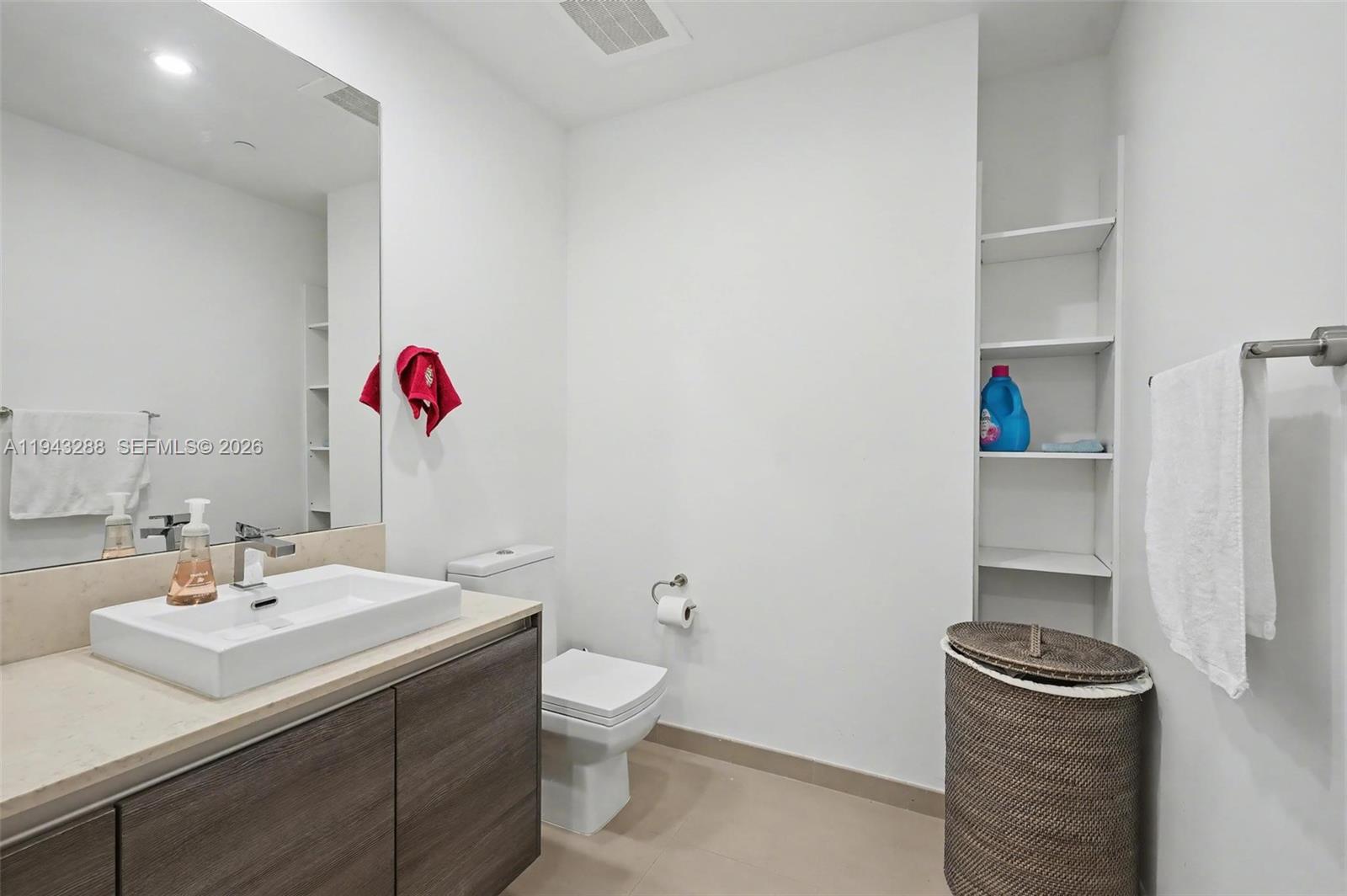 1080 Brickell Avenue, Unit 209 Miami, FL 33131 - Photo 23 of 37 a bathroom with a sink a toilet and a shower