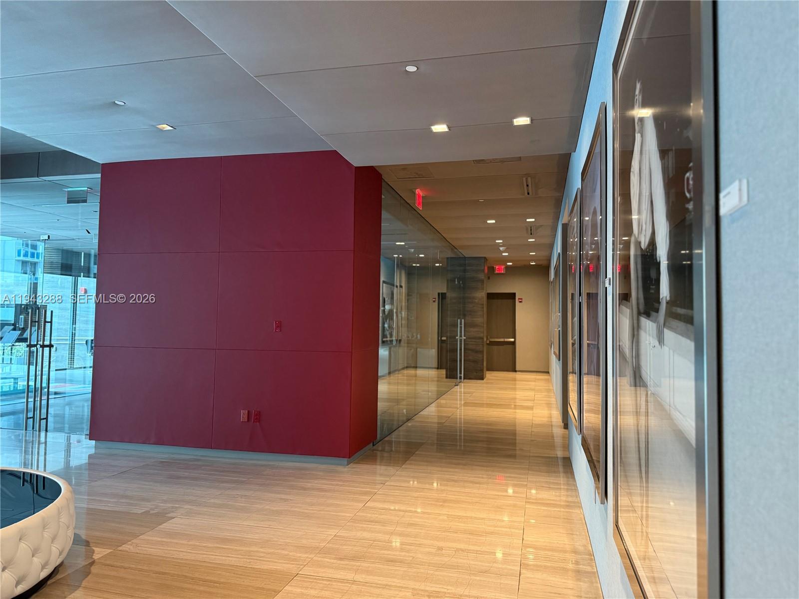1080 Brickell Avenue, Unit 209 Miami, FL 33131 - Photo 34 of 37 a view of a hallway with a livingroom