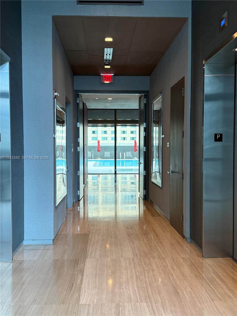 1080 Brickell Avenue, Unit 209 Miami, FL 33131 - Photo 36 of 37 a view of empty room with wooden floor and fan