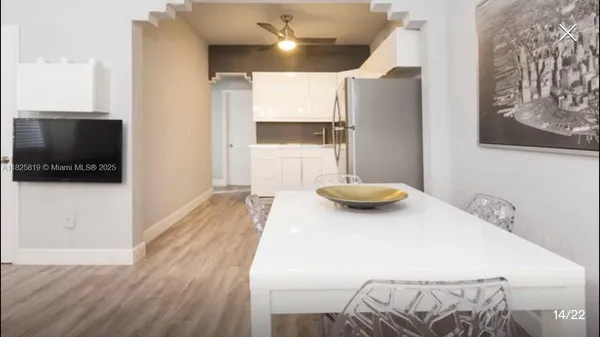 a view of a living room and a flat screen tv