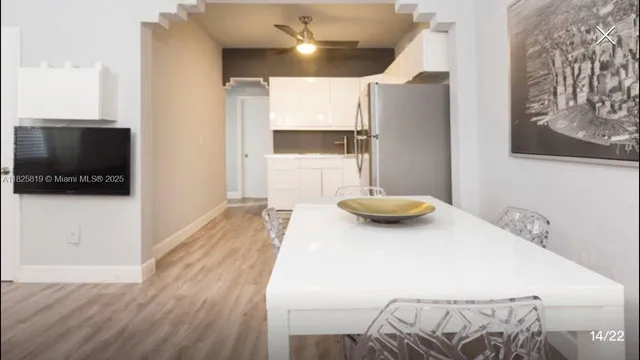 a view of a living room and a flat screen tv