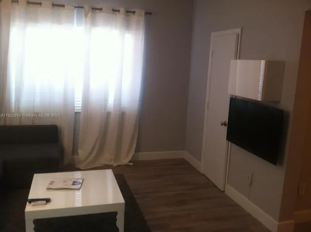 a view of a hallway with washer and dryer