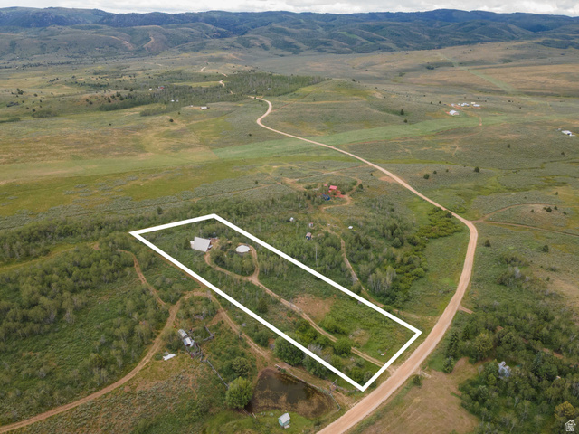 23 Scare Canyon, Unit 23 Logan, UT 84321 - Photo 32 of 33 Rural property featuring a single-story dwelling, two circular structures, and extensive natural landscape