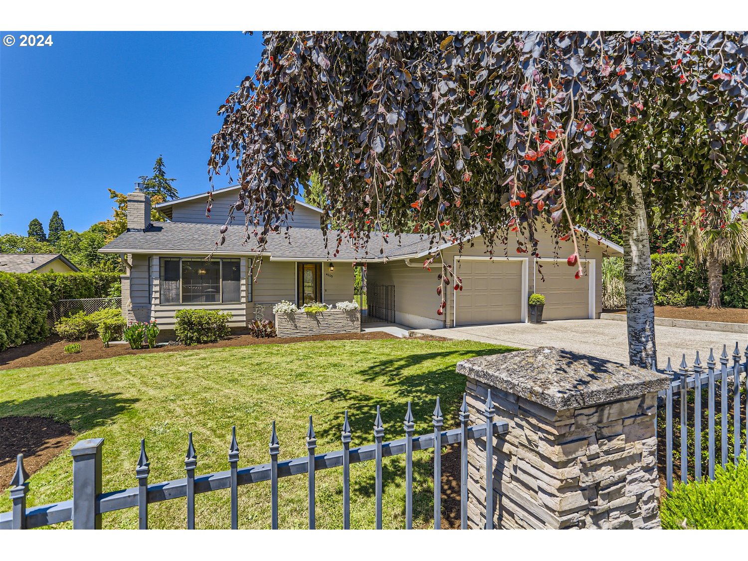 a front view of a house with garden