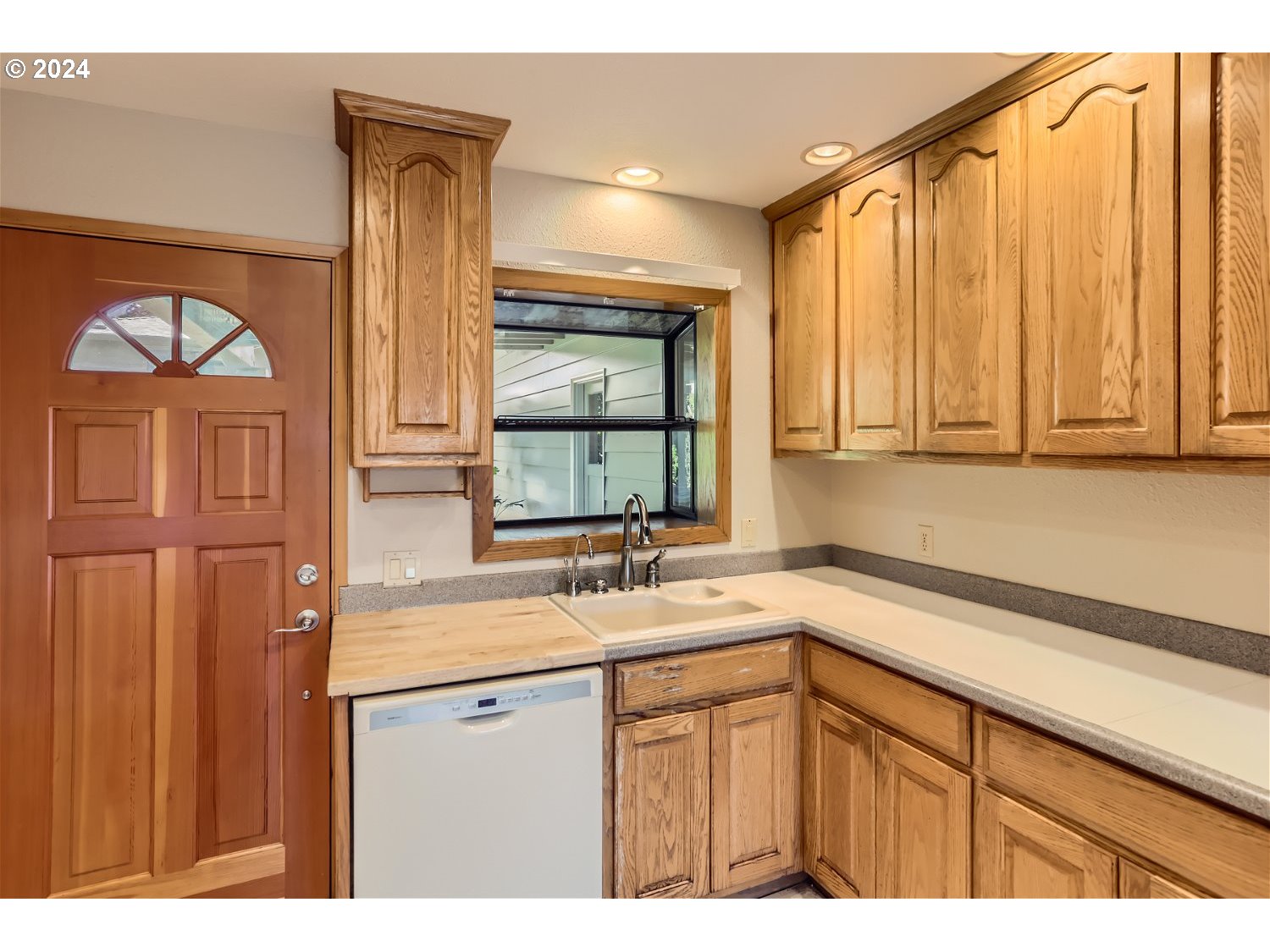 4009 Southeast View Acres Road Milwaukie, OR 97267 - Photo 13 of 37 a kitchen with a sink and a window