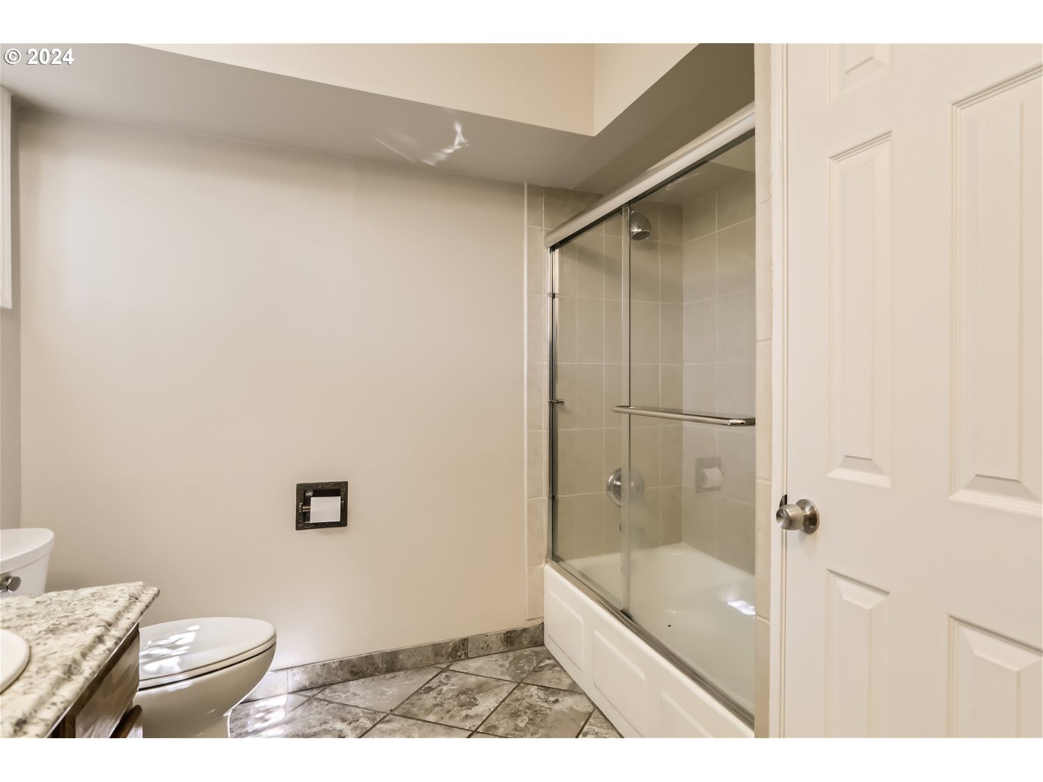 4009 Southeast View Acres Road Milwaukie, OR 97267 - Photo 18 of 37 a bathroom with a granite countertop sink a toilet and shower