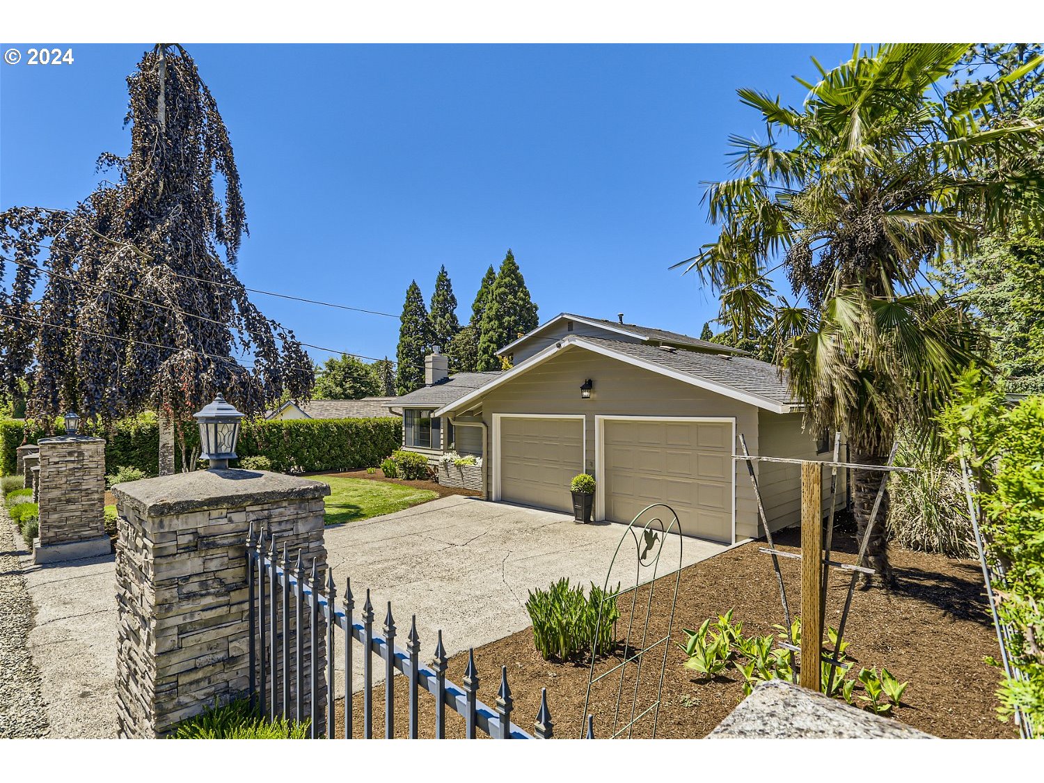 4009 Southeast View Acres Road Milwaukie, OR 97267 - Photo 3 of 37 a house with green field in front of it
