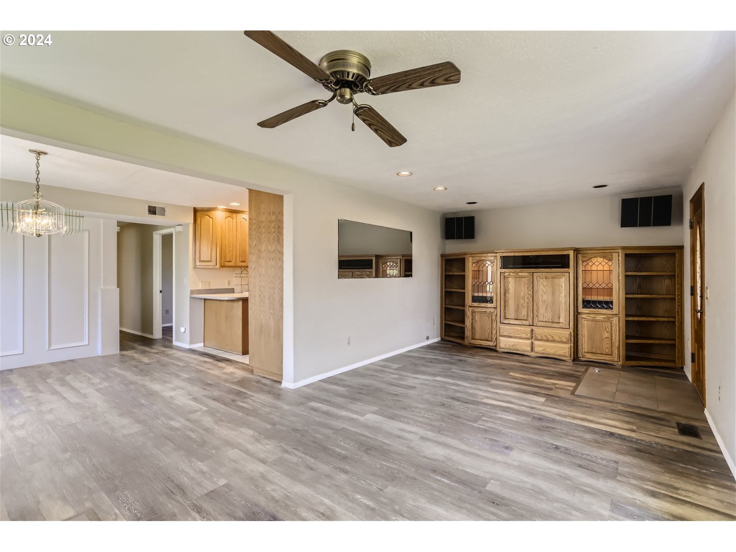 4009 Southeast View Acres Road Milwaukie, OR 97267 - Photo 8 of 37 a view of empty room with wooden floor and ceiling window